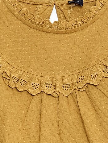 Blouse manches longues col rond avec plastron volanté avec broderies