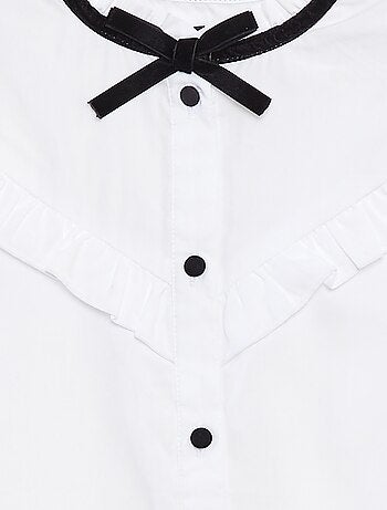 Chemisier avec volants et nœud fantaisie au col