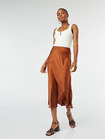 Débardeur sans manches avec encolure dégagée et bouton doré fantaisie