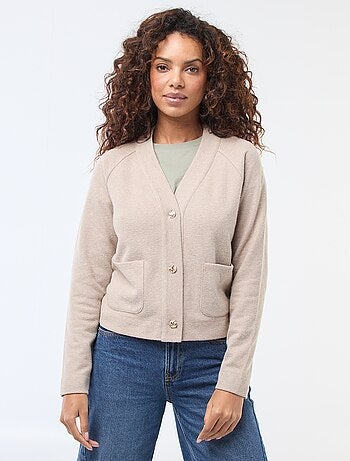 Gilet avec ouverture boutonnée dorée