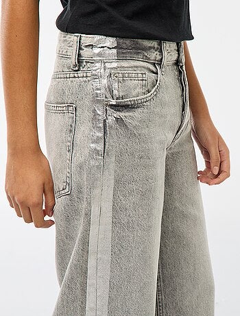 Jean baggy avec bandes argentées