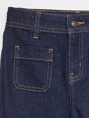 Jean coupe flare/bootcut avec poches plaquées