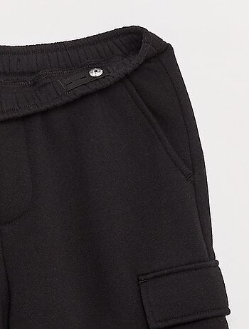 Jogging en molleton uni multi-poches