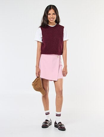 Jupe short asymétrique avec bouton doré