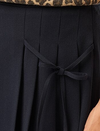 Jupe short plissée avec nœud