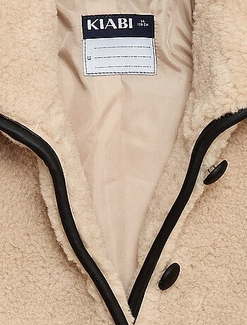 Manteau fausse fourrure avec ouverture pressionnée