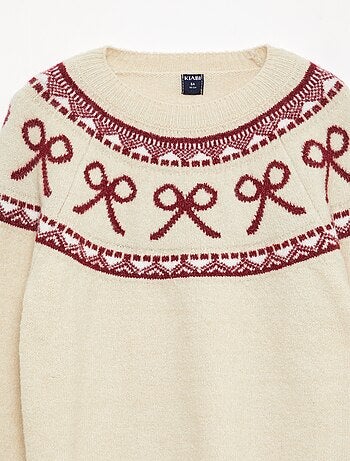 Pull col rond avec motif de noeuds