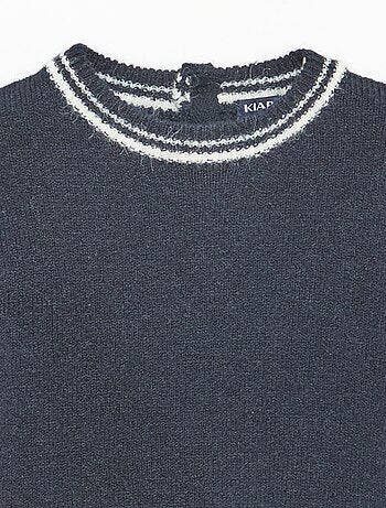 Pull uni avec bords contrastés