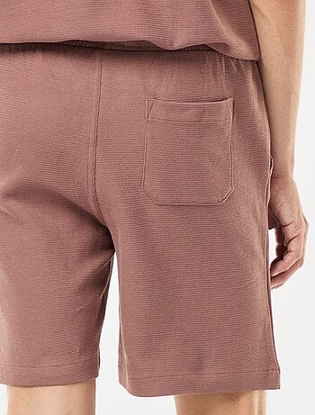 Short de sport avec poches en maille fantaisie