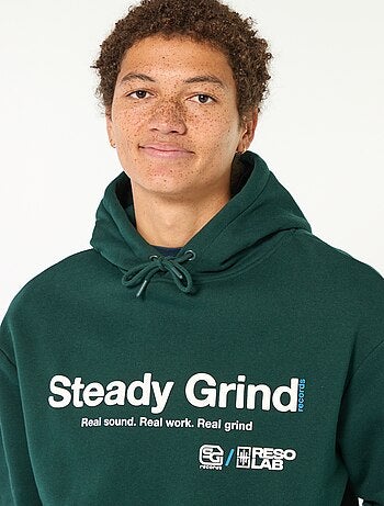 Sweat à capuche inscription devant et dos