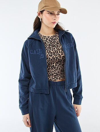 Sweat court zippé à message brodé