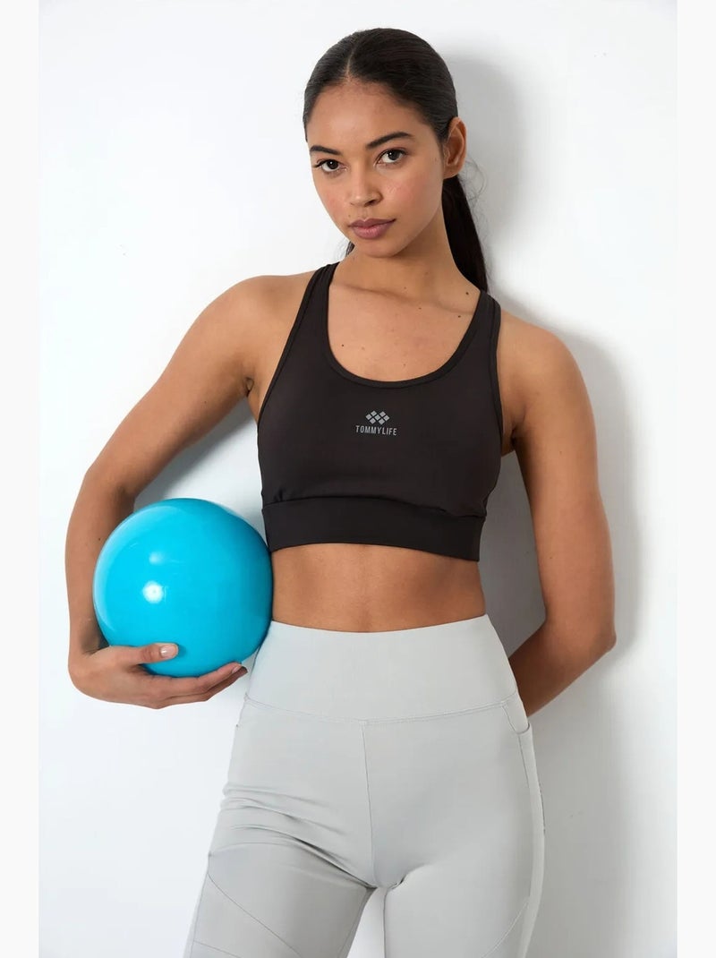 Aansluitend mouwloos cropped sporttop tommy Zwart - Kiabi