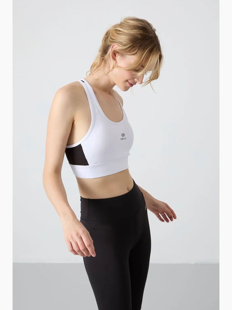 Aansluitend mouwloos cropped sporttop tommy Zwart - Kiabi