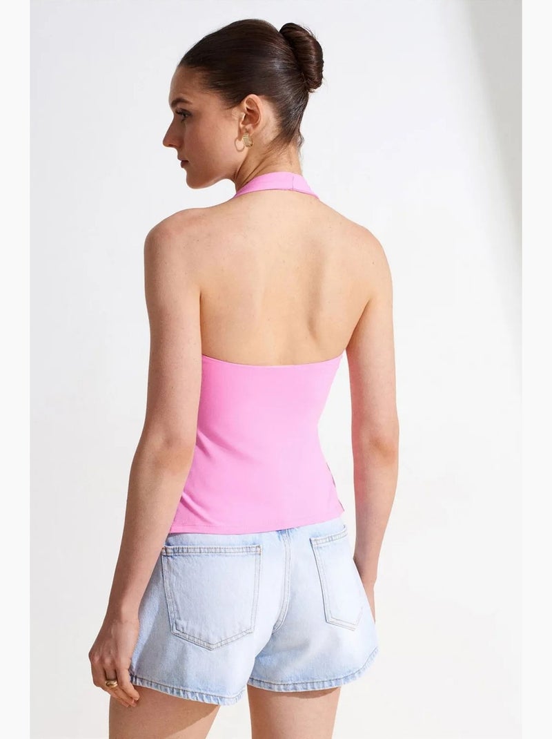 Aansluitende haltertop met cut-out dilvin Fluorroze/Solinotes - Kiabi