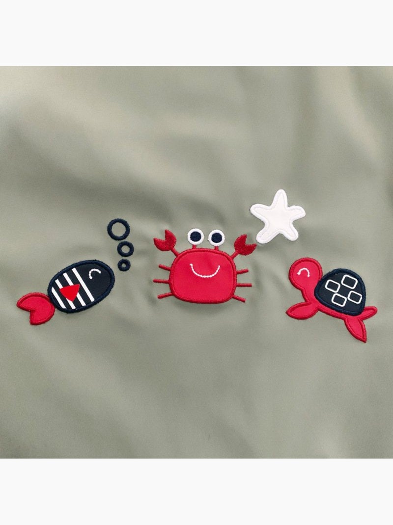 Babyregenjas met capuchon 'Breizh Ocean', gestreepte binnenponcho met borduurwerk Pastelgroen - Kiabi