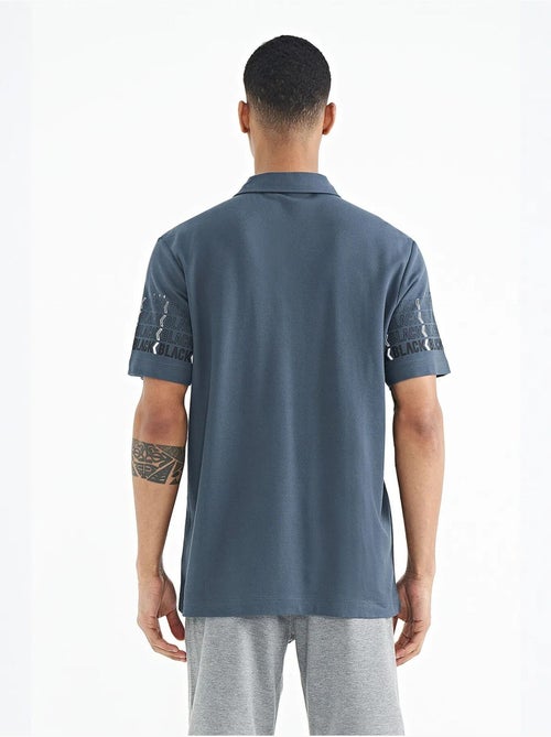 Bedrukt t-shirt met polokraag tommy - Kiabi Bedrukt t-shirt met polokraag tommy - Kiabi