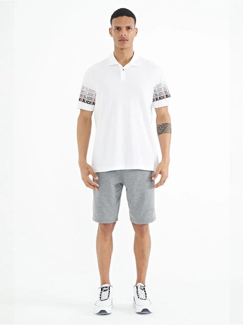 Bedrukt t-shirt met polokraag tommy - Kiabi Bedrukt t-shirt met polokraag tommy - Kiabi