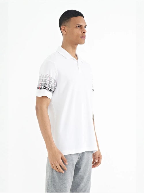 Bedrukt t-shirt met polokraag tommy - Kiabi Bedrukt t-shirt met polokraag tommy - Kiabi