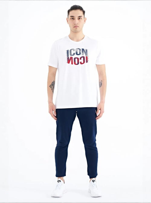 Bedrukt t-shirt met ronde hals en patch tommy - Kiabi Bedrukt t-shirt met ronde hals en patch tommy - Kiabi