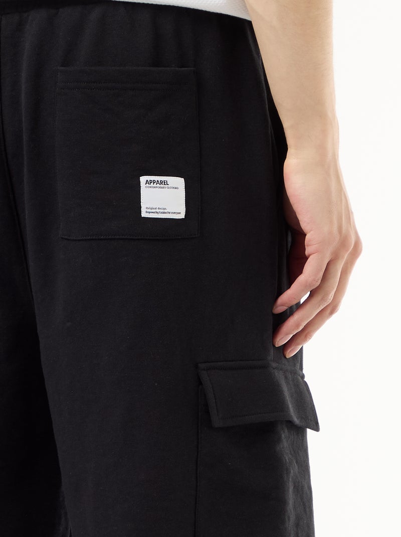 Bermuda van lichte sweatstof met klepzakken Zwart - Kiabi