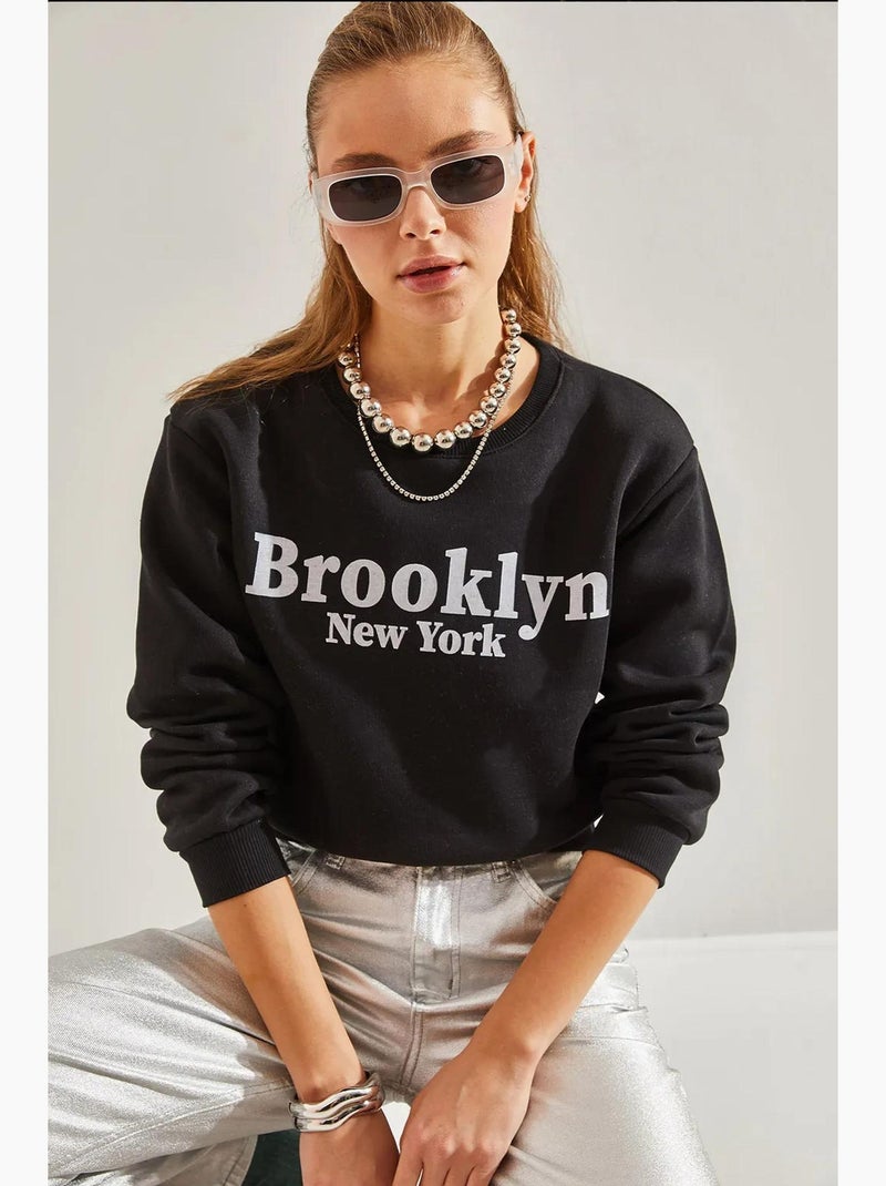 Bianco bedrukte drie-draads cropped sweatshirt lucci Zwart - Kiabi