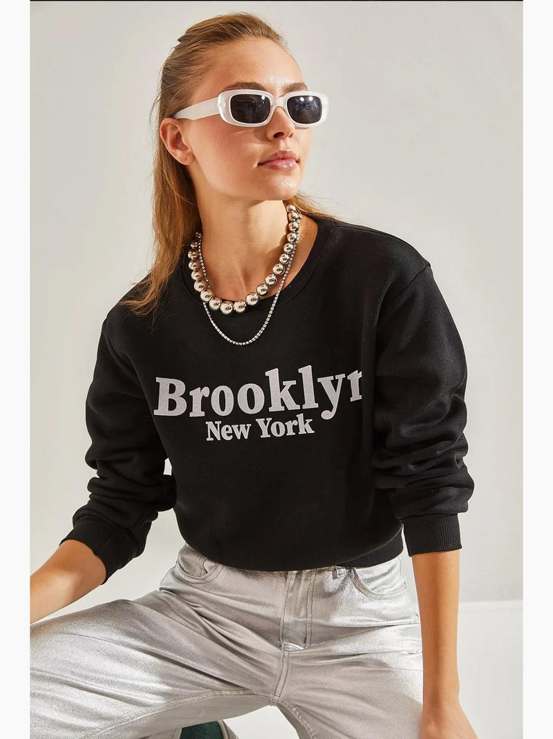 Bianco bedrukte drie-draads cropped sweatshirt lucci Zwart - Kiabi
