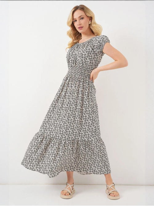 Bloemen a-lijn maxi-jurk met elastische details bdart - Kiabi Bloemen a-lijn maxi-jurk met elastische details bdart - Kiabi