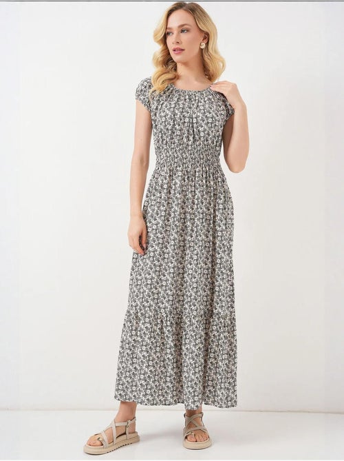 Bloemen a-lijn maxi-jurk met elastische details bdart - Kiabi Bloemen a-lijn maxi-jurk met elastische details bdart - Kiabi