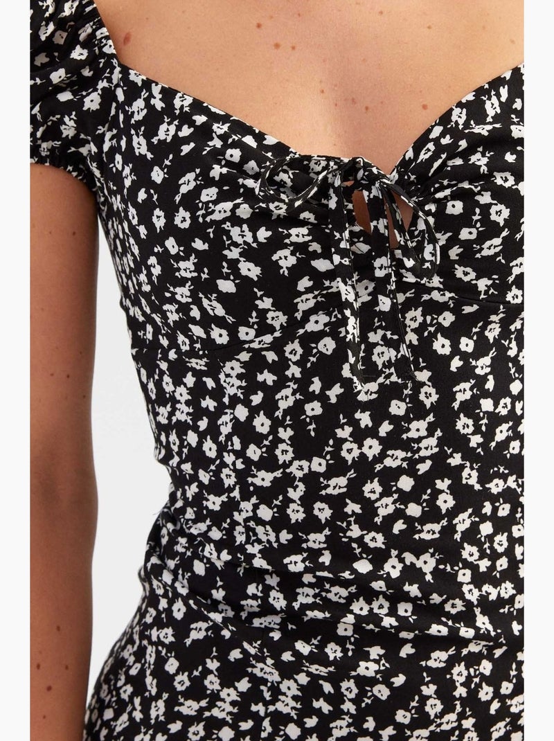 Bloemen midi-jurk met blote schouders en zijsplit hiccup Zwart - Kiabi