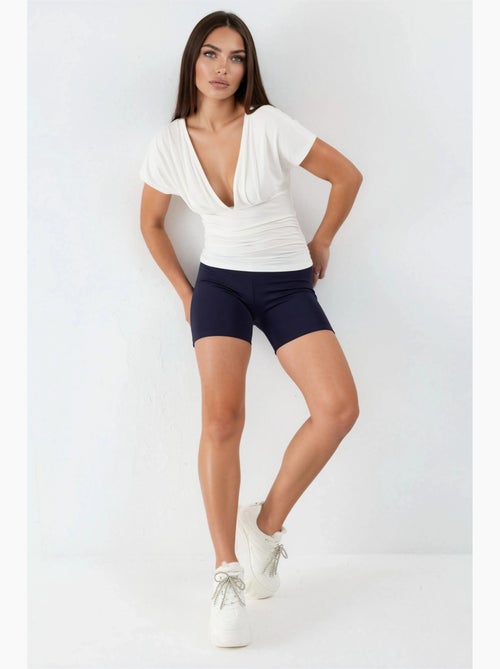 Blouse à col v avec détail nœud busem - Kiabi Blouse à col v avec détail nœud busem - Kiabi