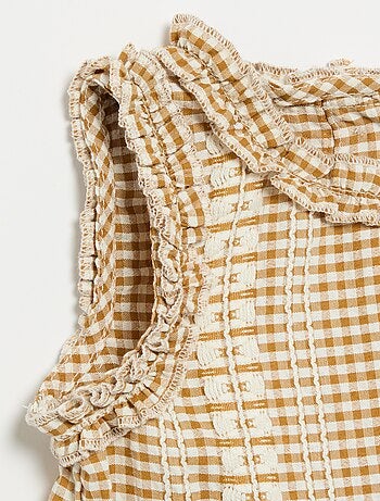 Blouse à volants aux emmanchures
