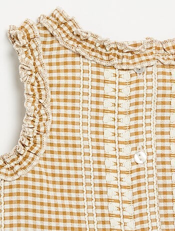 Blouse à volants aux emmanchures