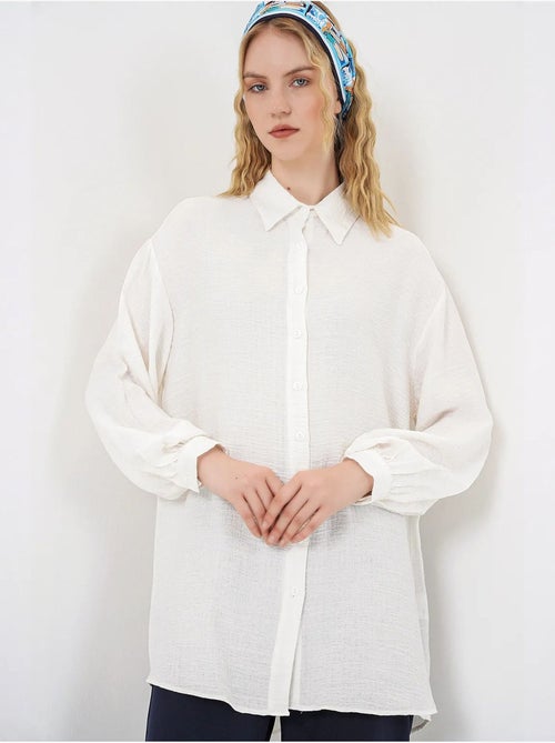 Blouse longue oversize texturée avec col chemise bdart - Kiabi Blouse longue oversize texturée avec col chemise bdart - Kiabi