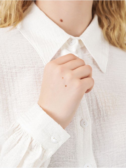 Blouse longue oversize texturée avec col chemise bdart - Kiabi Blouse longue oversize texturée avec col chemise bdart - Kiabi