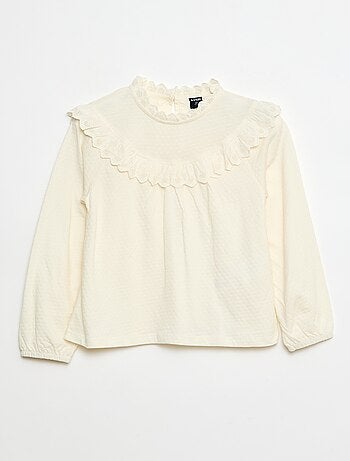 Blouse manches longues col rond avec plastron volanté avec broderies