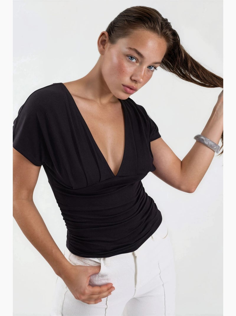 Blouse met v-hals en strikdetail busem Zwart - Kiabi