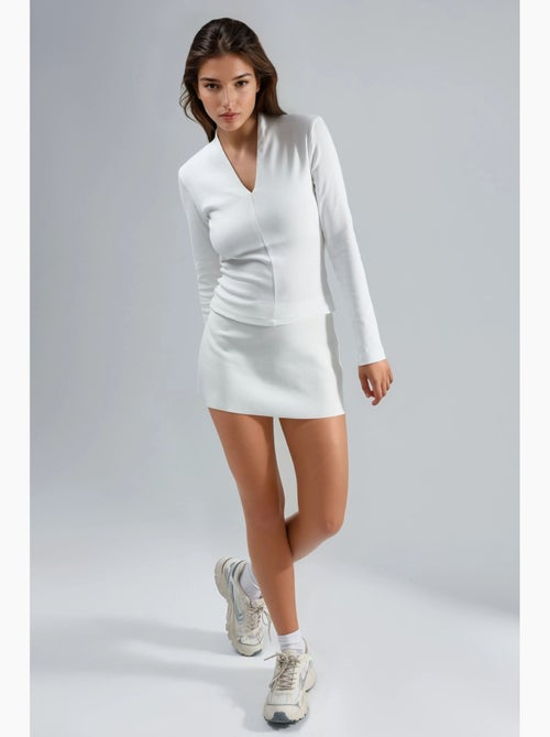 Blouse slim à manches longues avec col en v busem - Kiabi Blouse slim à manches longues avec col en v busem - Kiabi