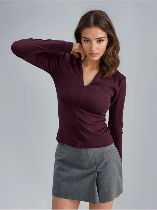 Blouse slim à manches longues avec col en v busem - Kiabi Blouse slim à manches longues avec col en v busem - Kiabi