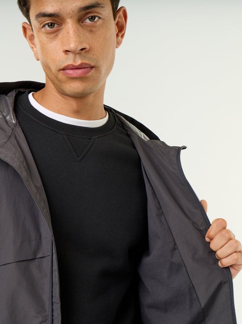 Blouson coupe-vent à capuche déperlant - Kiabi
