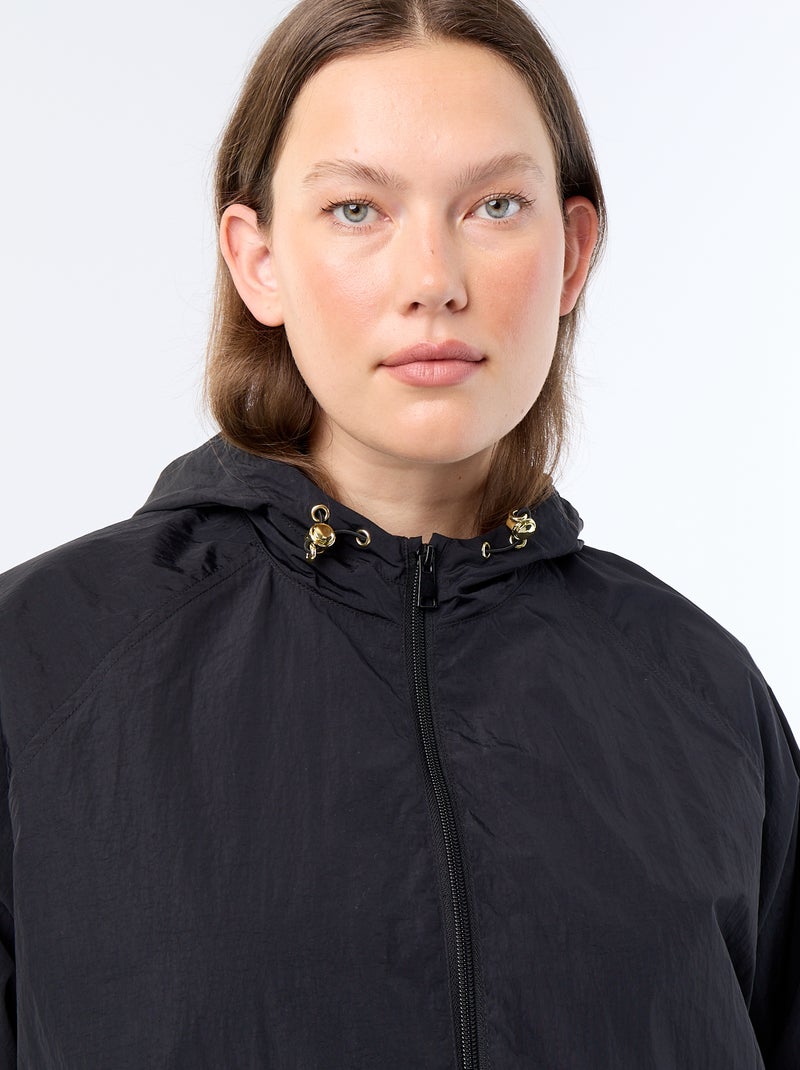 Blouson coupe-vent avec détails dorés Noir - Kiabi