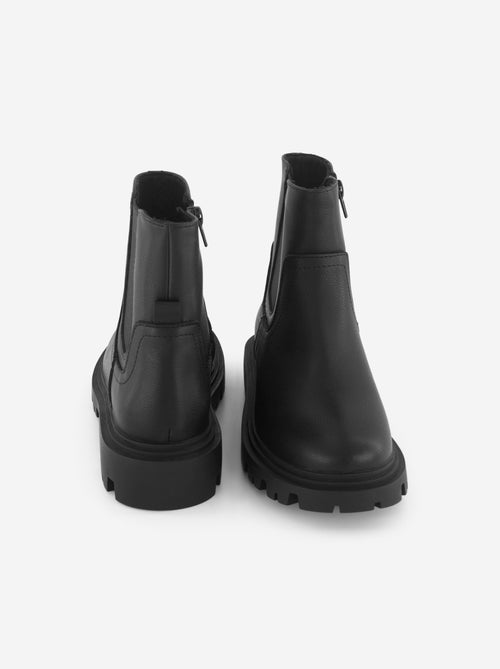 Boots en simili avec semelle crantée - Kiabi Boots en simili avec semelle crantée - Kiabi