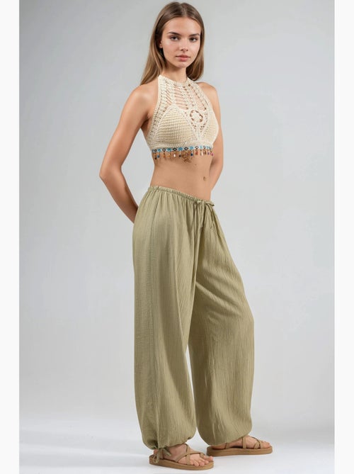 Broek met elastische taille en strikdetail busem - Kiabi Broek met elastische taille en strikdetail busem - Kiabi