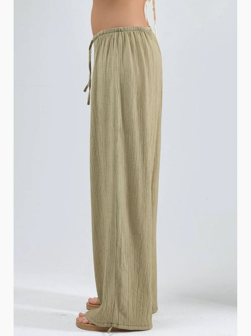 Broek met elastische taille en strikdetail busem - Kiabi Broek met elastische taille en strikdetail busem - Kiabi