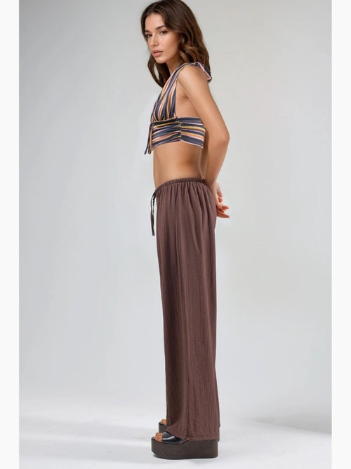 Broek met elastische taille en strikdetail busem - Kiabi Broek met elastische taille en strikdetail busem - Kiabi