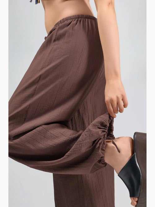 Broek met elastische taille en strikdetail busem - Kiabi Broek met elastische taille en strikdetail busem - Kiabi