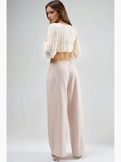 Broek met elastische taille en strikdetail busem - Kiabi Broek met elastische taille en strikdetail busem - Kiabi