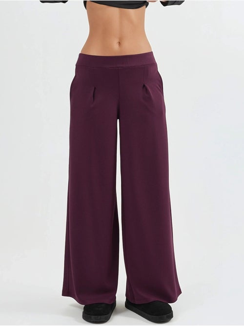Broek met elastische taille en wijde pijpen busem - Kiabi Broek met elastische taille en wijde pijpen busem - Kiabi