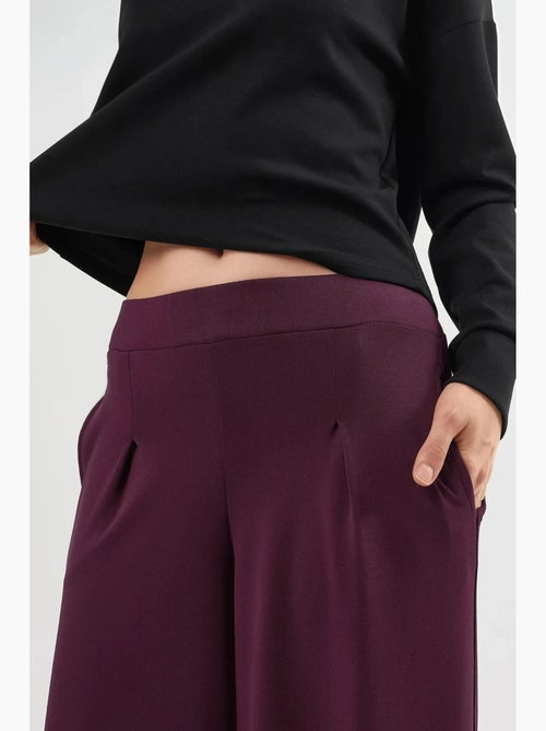Broek met elastische taille en wijde pijpen busem - Kiabi Broek met elastische taille en wijde pijpen busem - Kiabi