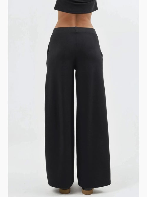 Broek met elastische taille en wijde pijpen busem - Kiabi Broek met elastische taille en wijde pijpen busem - Kiabi