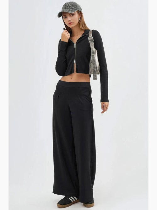 Broek met elastische taille en wijde pijpen busem - Kiabi Broek met elastische taille en wijde pijpen busem - Kiabi